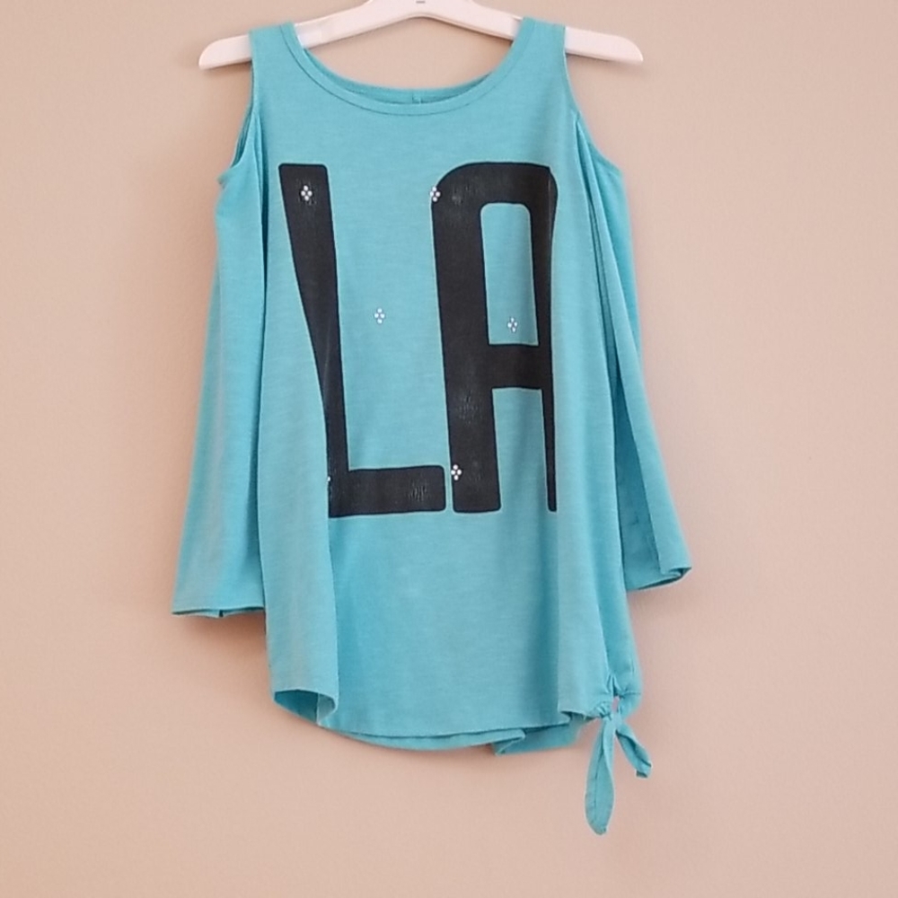 Light Blue exposed shoulder long sleeve shirt.